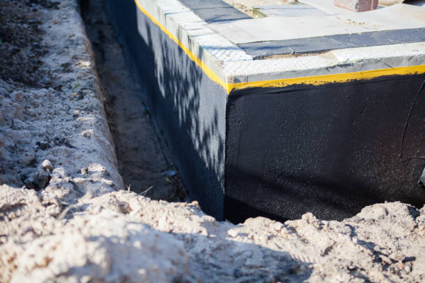 Professional Waterproofing technician working in Belding, MI